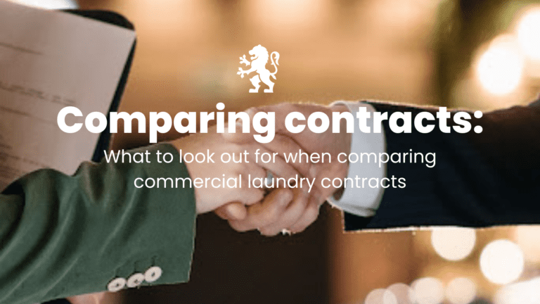 Comparing commercial laundry contracts - photo of shaking hands on a contract agreement.